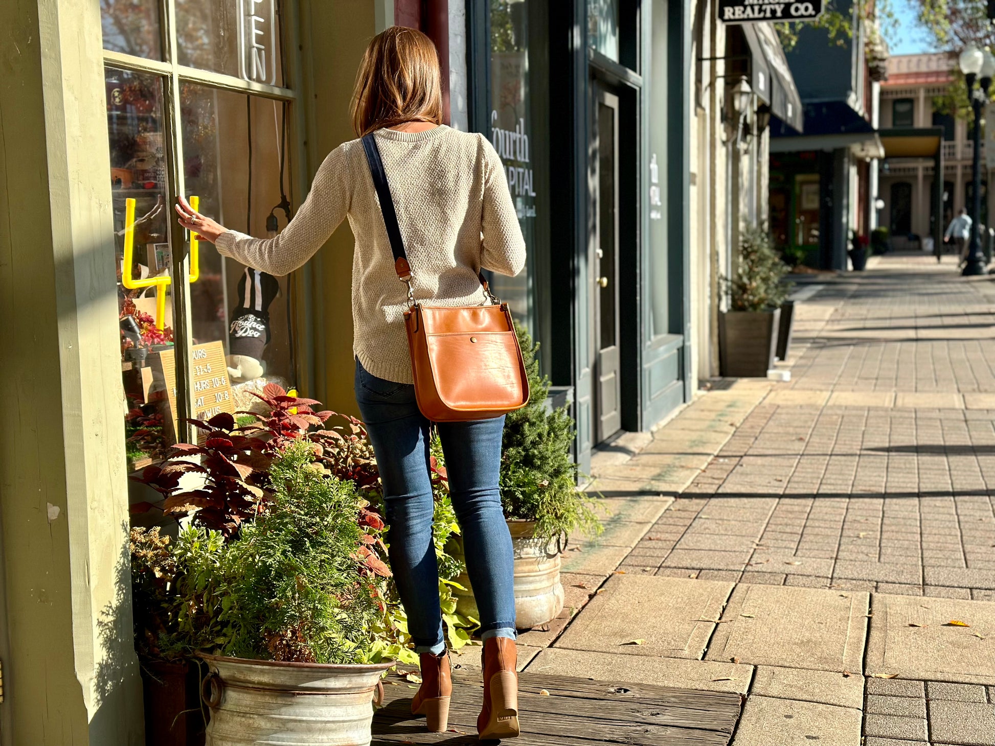 Jackson Wayne Cumberland Crossbody - women's full grain leather purse in saddle tan leather blue canvas strap window shopping Franklin, Tennessee