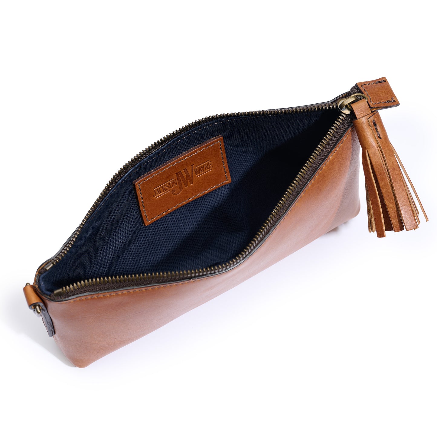 inside Jackson Wayne broadway wristlet with midnight blue lining in saddle tan leather