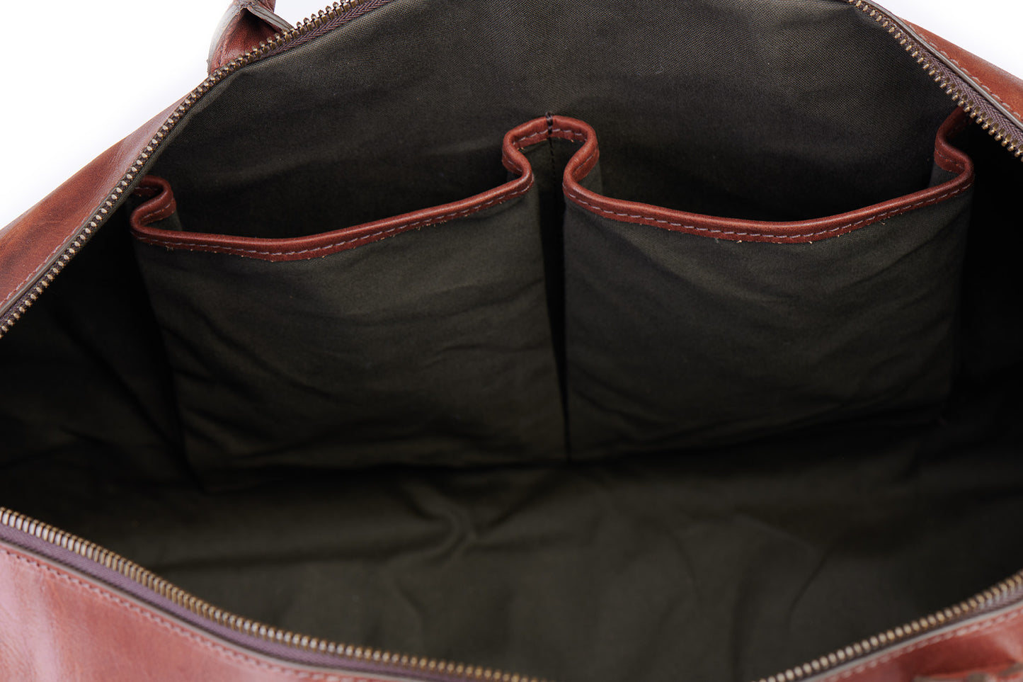 inside slip pockets on big sur duffle bag in vintage brown green lining