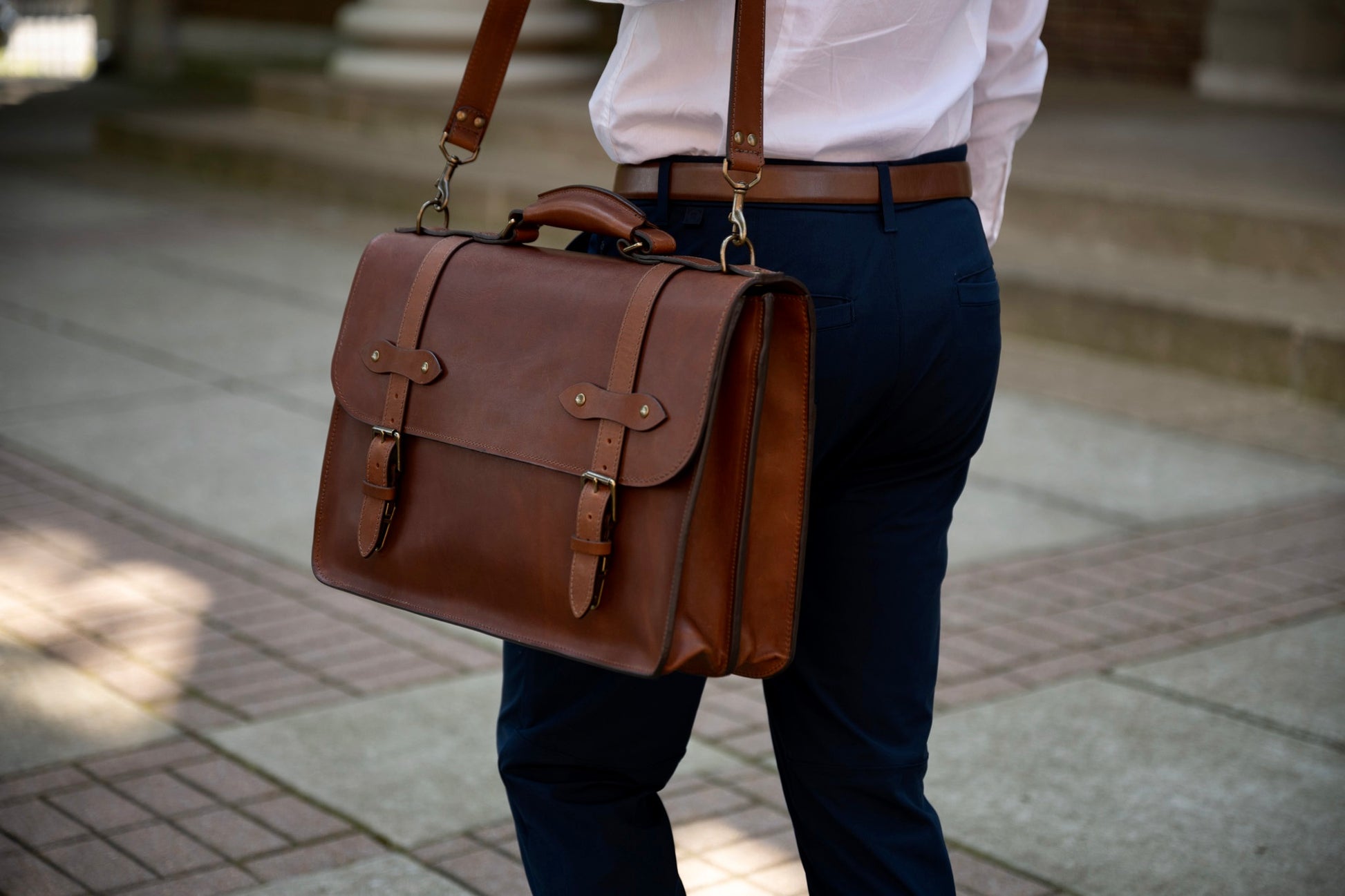 vintage brown esq. briefcase by Jackson Wayne full grain leather angled with shoulder strap