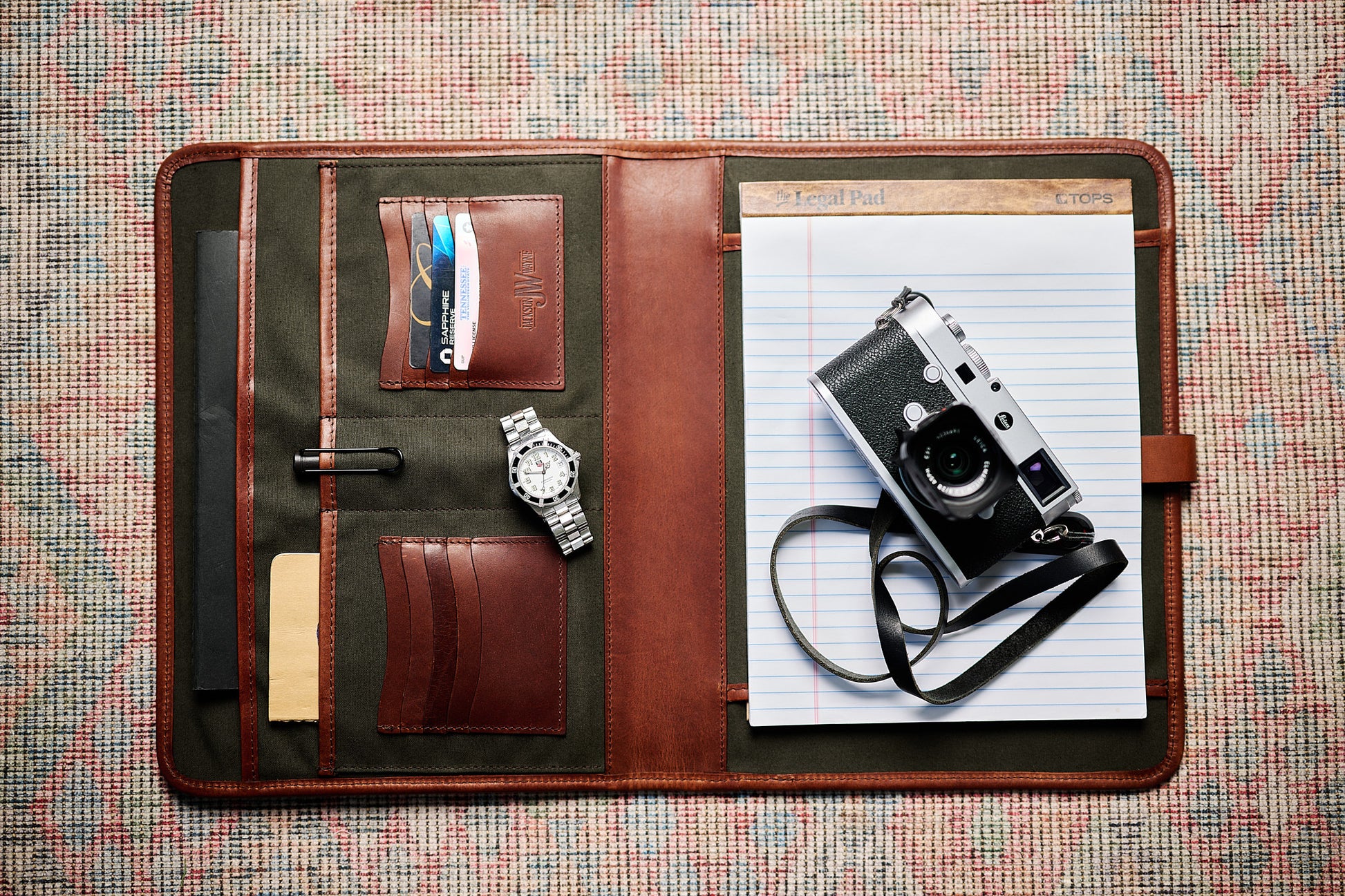 full grain vintage brown leather pad folio portfolio with pockets filled and vintage camera