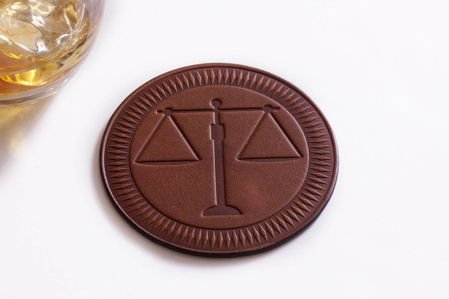 full grain leather coasters wit scales of justice design for law office accessory or lawyer gift