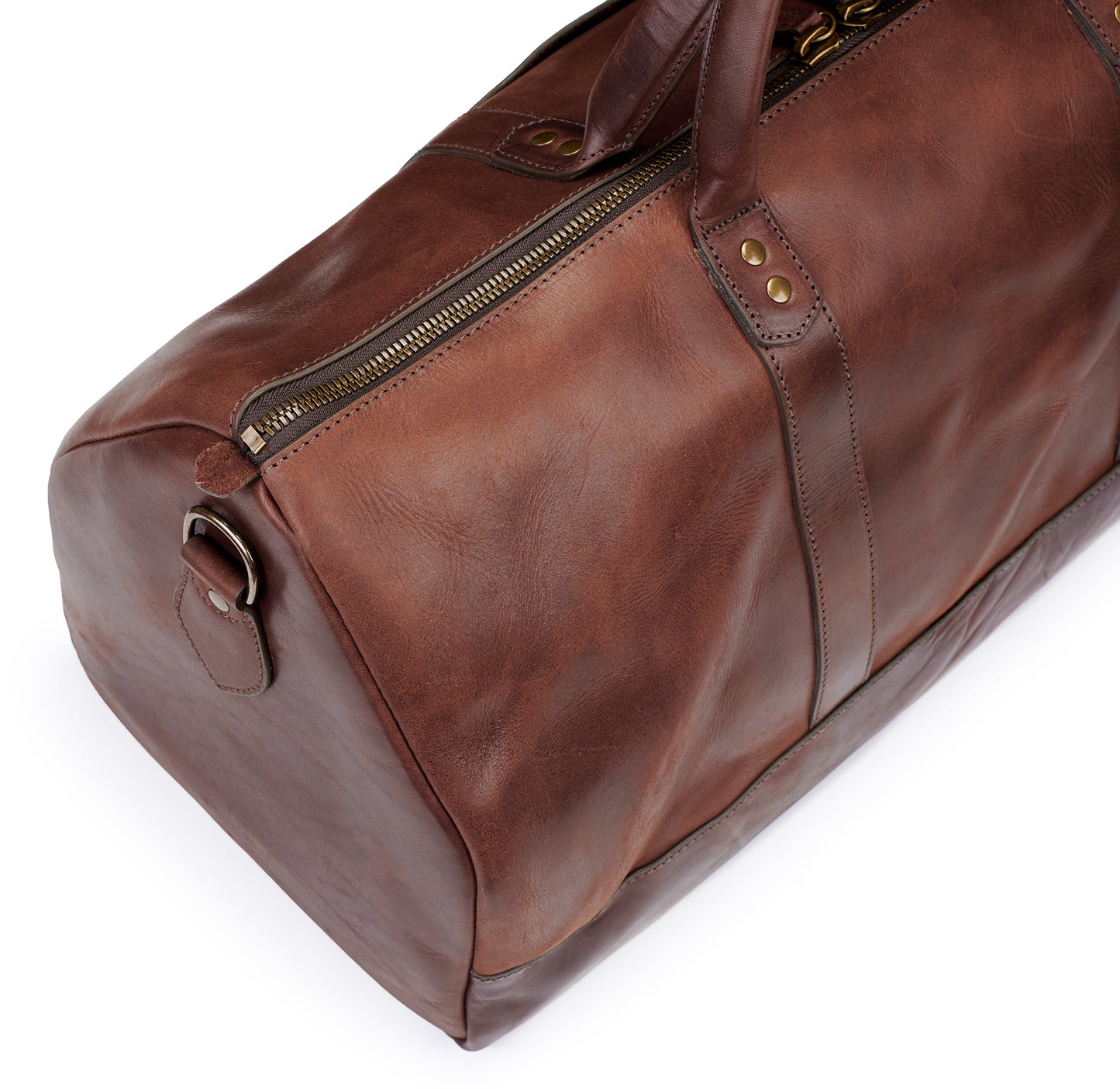 top detail of vintage brown vegetable tanned leather duffel bag weekender