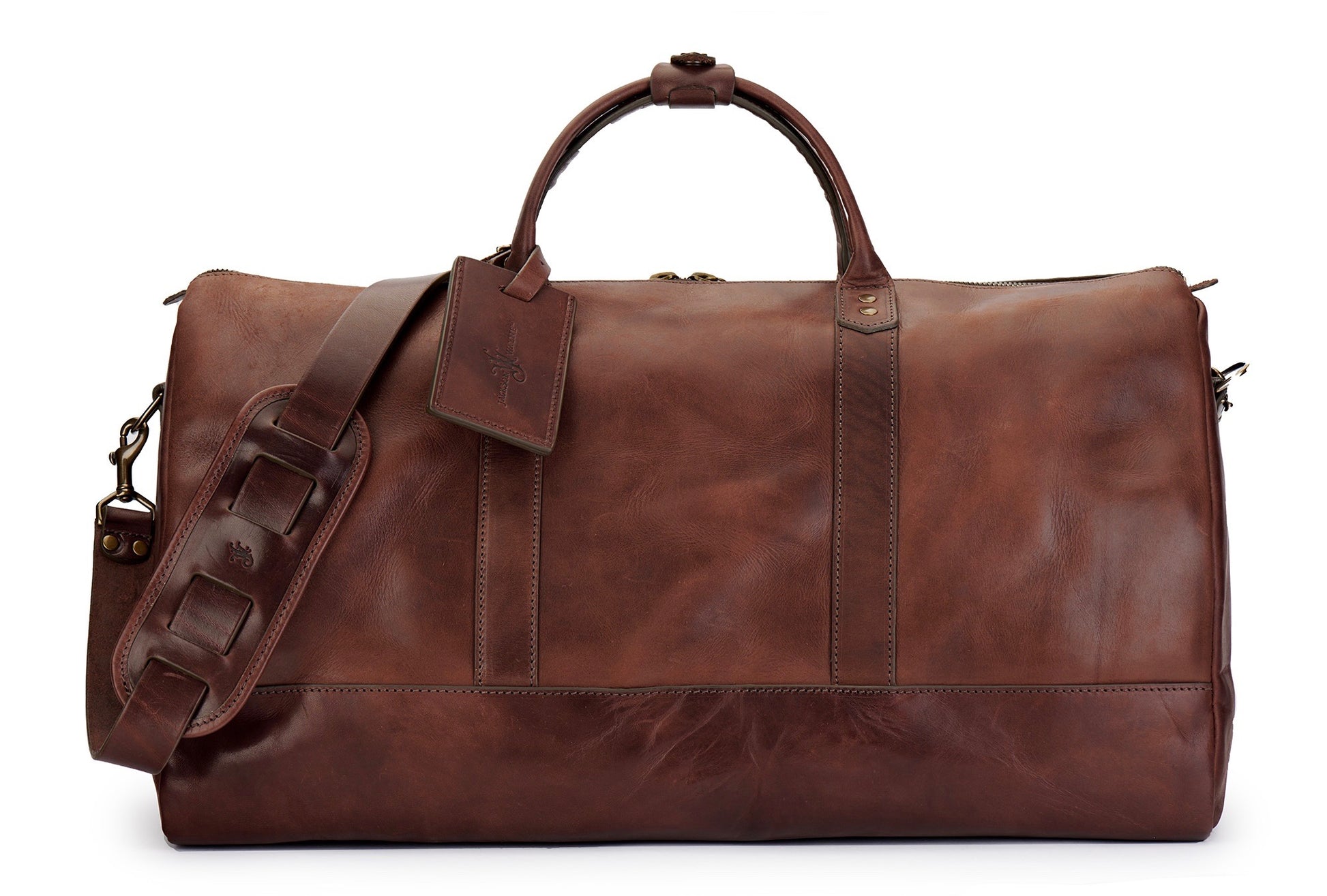 saddle tan full grain leather weekender bag with luggage tag in vintage brown and shoulder strap