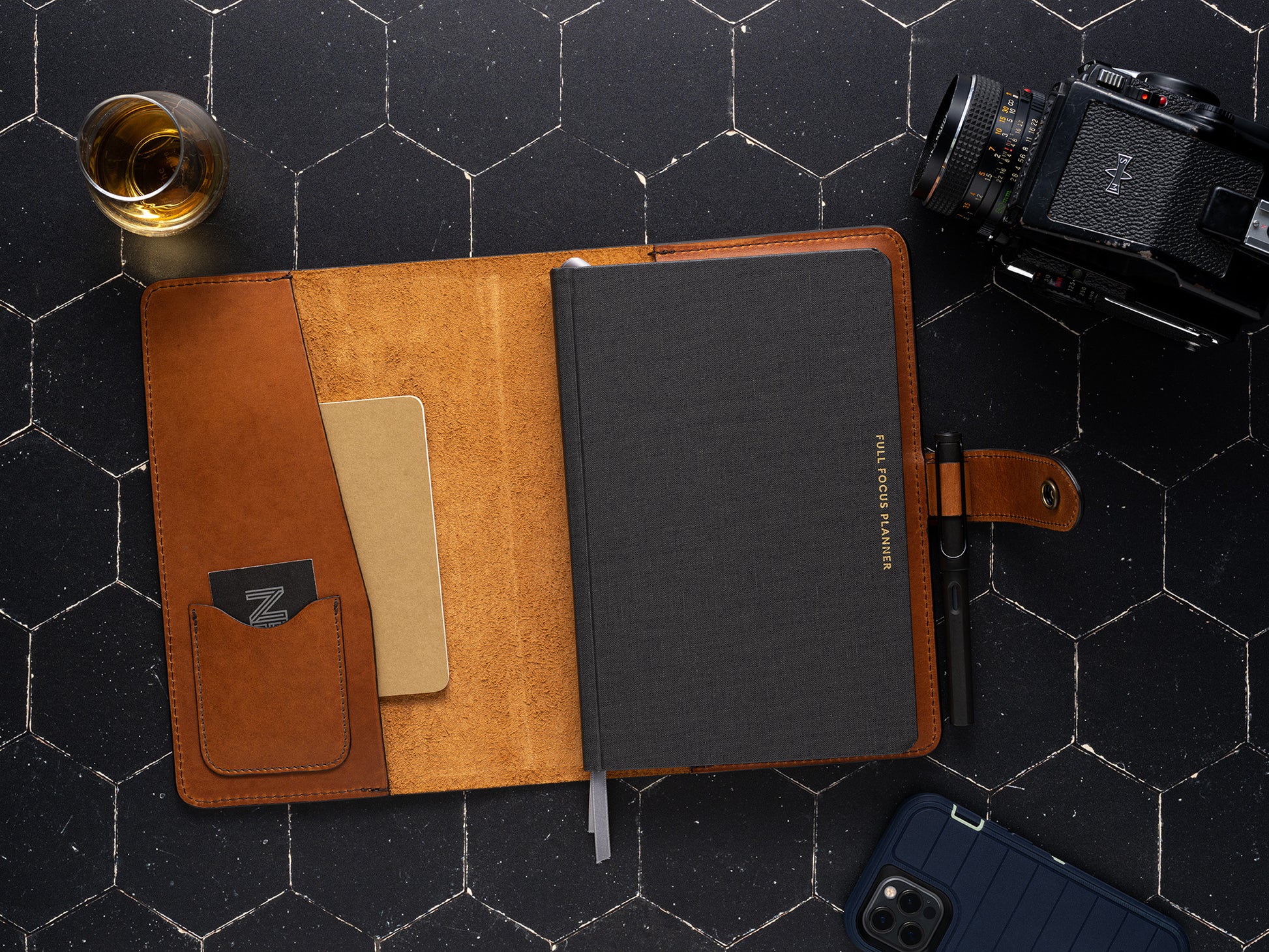 lifestyle shot of full grain leather planner cover that fits full focus planner system by Michael Hyatt - pictured in saddle tan leather